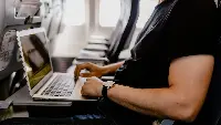 Using Wi-Fi service on board an aircraft.