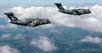 Two KC-390 Millennium aircraft during an aerial refuelling qualification