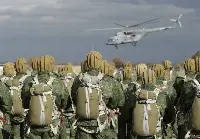 Russian paratroopers with a Mil Mi-26 helicopter in the background
