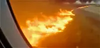 The SSJ-100 airplane of Aeroflot leaves tongues of fire on the runway of the Moscow-Sheremetyevo airport