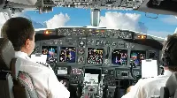 Two pilots in the cockpit of a Boeing B-737
