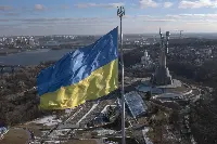 The flag of Ukraine flies over the capital Kiev