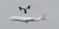 A drone during flight in front of a Boeing B-747/400 of British Airways