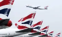 Tail of aircraft of British Airways and a B-747/400 during take-off