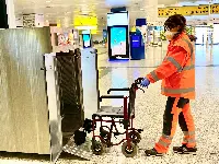 Airport employee with a wheelchair
