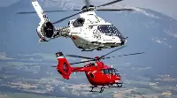 Helicopters in flight by Airbus Helicopters