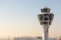 Munich Airport, tower, and aircraft in flight