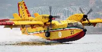 CL-415 airplane during a water refuelling for a fireghting operation
