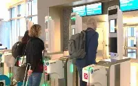 Passengers at Los Angeles with Vision Box biometric boarding