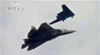 Sukhoi S-70 Okhotnik interacts with a Su-57