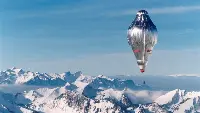 A balloon on the Swiss Alpine village of Château-d’Oex to attempt the first non-stop round-the-world balloon flight in 1999