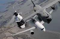 Airbus aircraft; two airplanes and a helicopter in flight