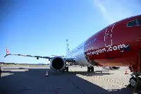 A Boeing B-737 MAX 8 aircraft of Norwegian Air park in an airport