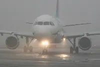 Airplane in taxiing on airport with snow (photo by Mauro Cini)