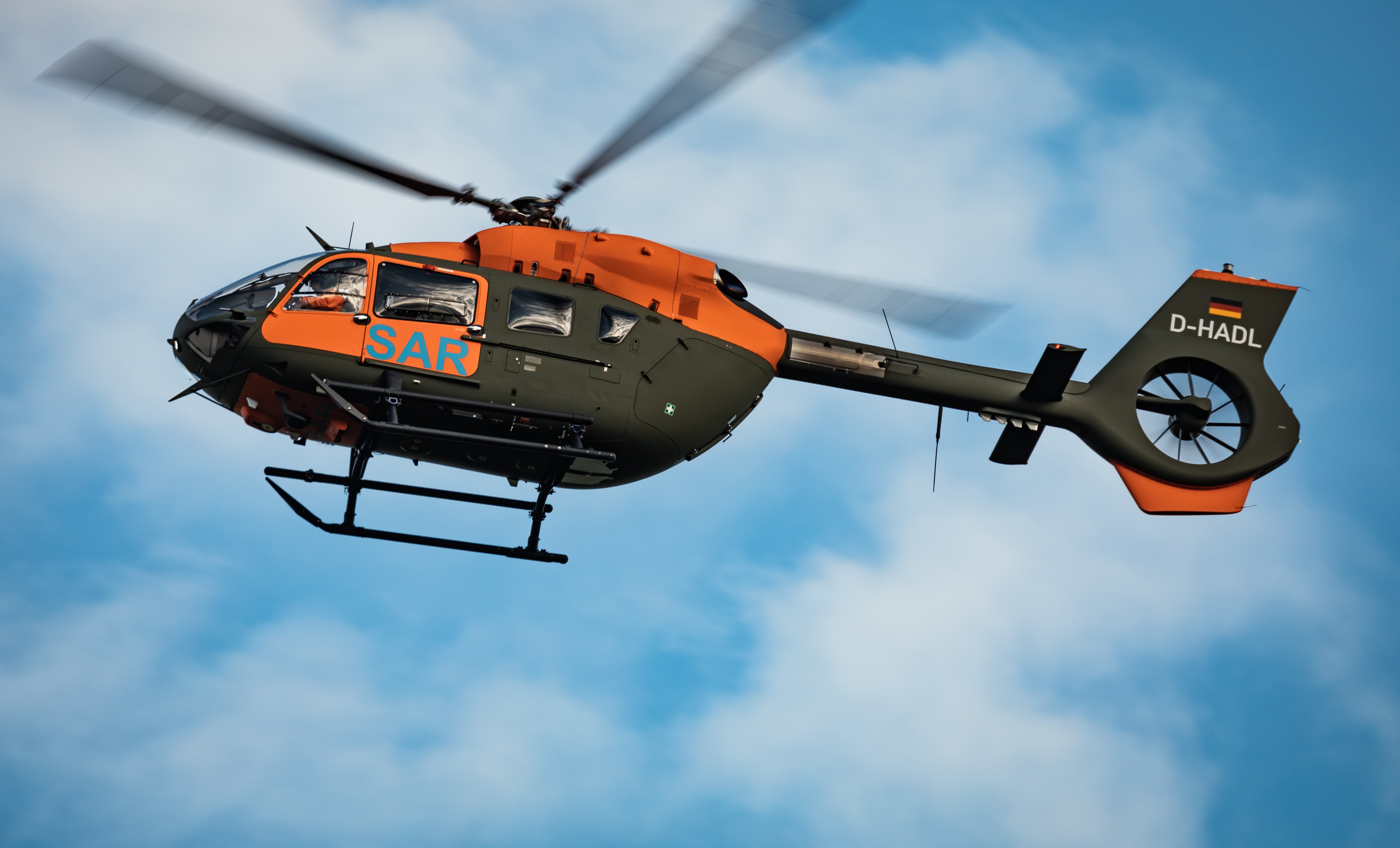 H-145 helicopter of the BAAINBw (German Armed Forces) easy to identify thanks to the bright orange paintwork on its doors, featuring ‘SAR’ in blue lettering